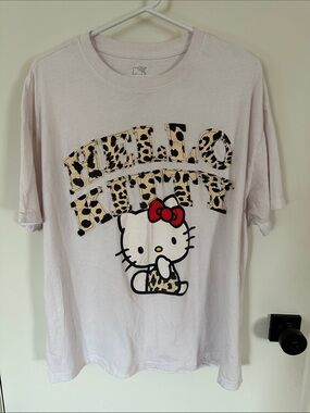 Hello Kitty Light Pink Tee with Leopard Print and Red Bow